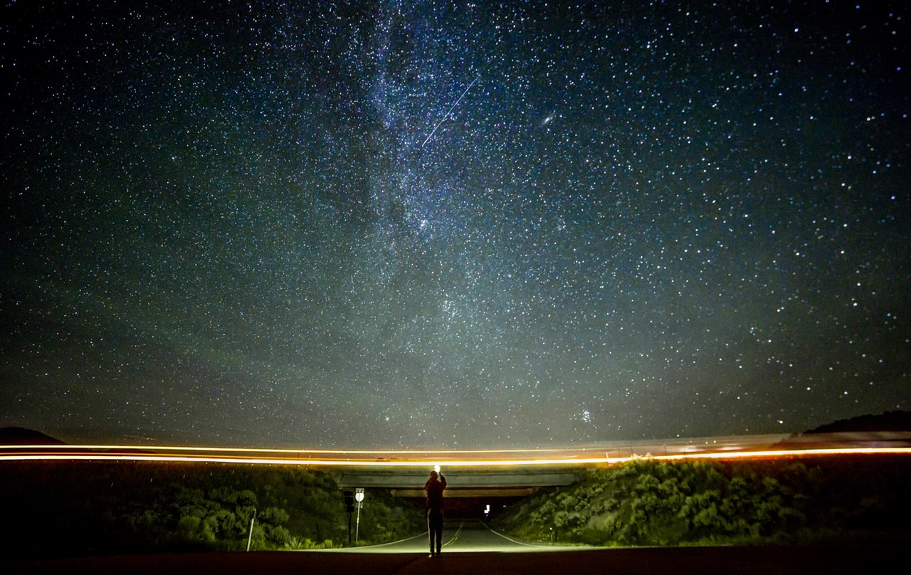 Pexels photo of night road and galaxies